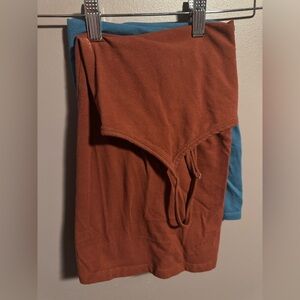 Two Torrid Foxy Tank Tops. Rust and Teal colors. Size 1.